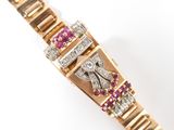 an image of a close up of a wrist with a diamond and ruby bracelet