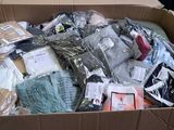 a cardboard box filled with assorted items in it