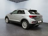 the rear end of a silver volkswagen suv parked in a garage