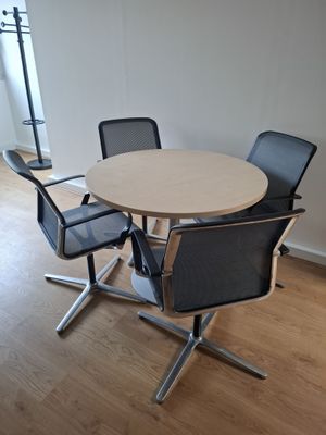 an image of a table and chairs in a room