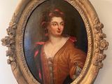a painting of a woman in a red dress hanging on a wall