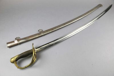 a pair of swords with a gold handle and a black handle
