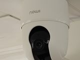 an image of a security camera mounted on the ceiling