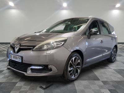 a picture of a silver car parked in a showroom