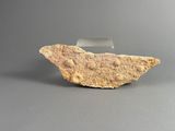 an image of a rock on a gray surface