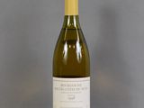 a bottle of wine that is sitting on a table