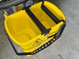 a yellow bucket with a hose and a yellow bucket with a hose