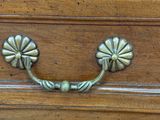 a close up of a drawer with a handle on it