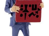 figurine of a man holding a sign with chinese characters on it