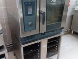two ovens that are sitting on a stand in a kitchen