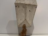 a sculpture of a face made out of cement