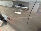 a close up of a car door handle with a sticker on it