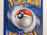 a close up of a pokemon card on a white surface