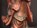 an image of a statue of a person holding a flower