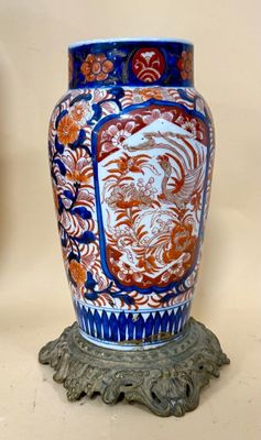two vases that are sitting on a table