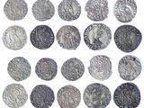 an image of a collection of silver coins on a white background
