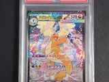 a close up of a pokemon card on a black surface