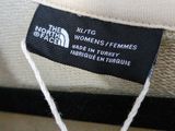 the north face logo on the label of a white hat