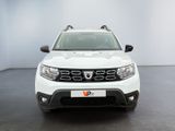 the front view of a white dacia parked in a white room
