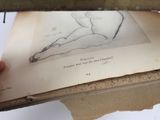 a person that is drawing a picture on a piece of paper