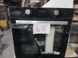 a black oven with a price tag on it in a store