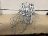 a bunch of wires and a bottle of water on a table