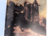 un livre ouvert sur lequel figure l'image d'un château