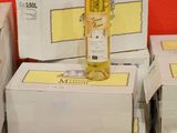 a bottle of wine sitting on top of a stack of boxes