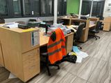 a desk with a chair and a computer on it