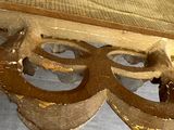 a bed with a wooden headboard and a wooden foot board