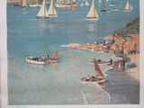 a large poster of boats in the water on the beach