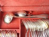 silverware in a red case with spoons and spoons in it
