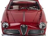 the front of a red car with a white stripe on the hood