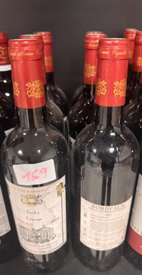 bottles of wine are lined up on a shelf in a store