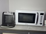 a microwave and a toaster sitting on a table