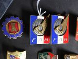 a lot of badges that are on a black table