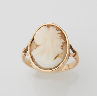 an 18k gold ring with a carved cameo of a woman