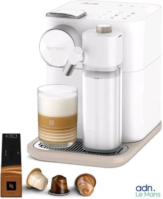 an image of a coffee machine with a cup of coffee next to it
