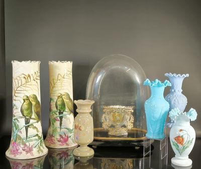 many vases that are sitting on a table