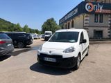 a white van that is parked in front of a building