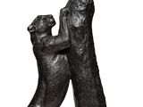 statue of two dogs playing with each other on a white background