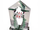 a glass bird feeder with a bird inside of it