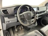 the interior of a car with a steering wheel and dashboard controls
