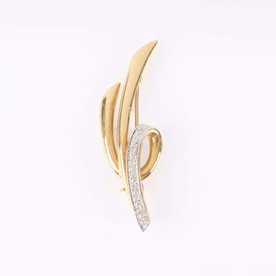 une image d'une broche en or et diamants