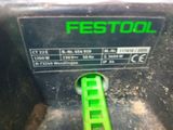 a close up view of a green and black machine