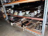 a shelf with pots and pans on it in a garage