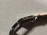 a close up of a watch that is on a table
