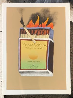 a picture of a lit match box with matches on it