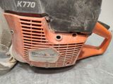 a close up of a chainsaw on a table
