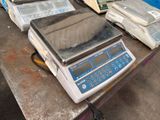 a table with a bunch of electronic items on it